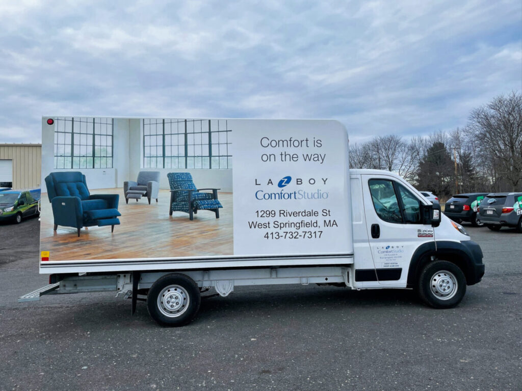 Comfortable Rooms truck with an image on the side for the West Springfield location